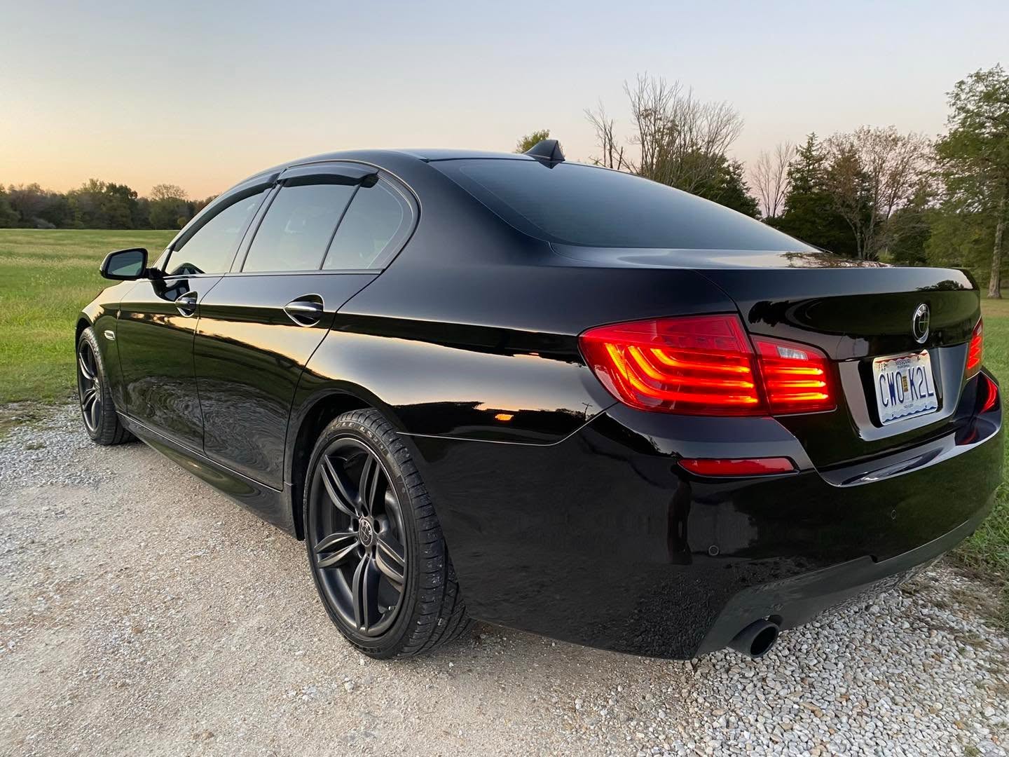 Black BMW sedan gleaming after a full detail